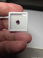 Front view of the oval sapphire in display case