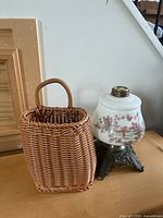 Basket and glass lamp base together