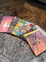 Fan layout of eight French early reader paperback books