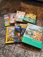 Nine assorted children’s books laid out showing covers