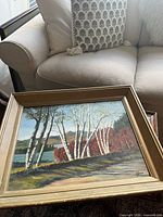 Front view of framed oil painting showing landscape scene