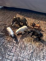 All five Schleich animal figurines displayed on floor