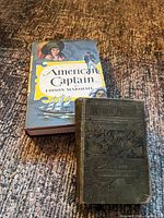 Front covers of both books showing titles, bindings and overall condition