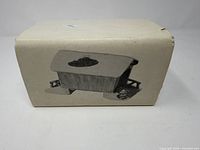 Department 56 cardboard box showing covered bridge image