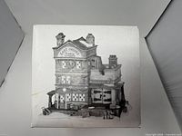 Front of original box showing building image