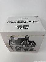 Box with Heritage Village Collection Dickens Village Series branding