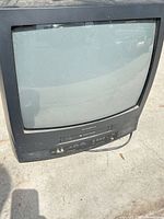 Front view showing screen, VCR slot, controls