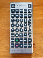 Front view of Innovage silver jumbo universal remote showing all buttons