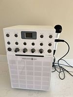 Front view of Singing Machine SML-388W with microphone