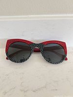 Front view of Vanni red and black cat-eye sunglasses