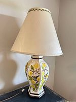 Full view of ceramic lamp with shade