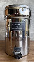 Front view of stainless steel Big Berkey tank showing label and spigot