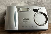 Front view showing model name, lens specs, flash window