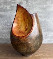 Front view showing teardrop opening and glazing