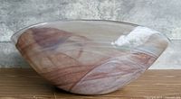 Side profile of the hand-blown glass bowl showing swirl pattern