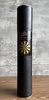 Full view of black tube packaging labelled Safety Magnetic Dart Board