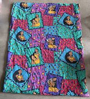 Full view of comforter printed with Pocahontas portraits