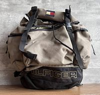 Front view showing overall backpack, embroidered HILFIGER logo and flag patch