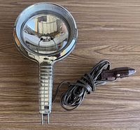 Full view of spotlight with cord and plug