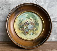 Front view of round framed miniature painting