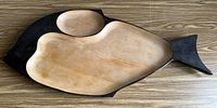 Top view of entire fish-shaped wooden platter showing compartments