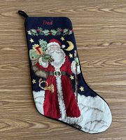 Front view showing needlepoint Santa design and "Dad" name