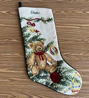 Front view showing needlepoint design, name, overall condition