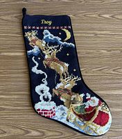 Front view showing needlepoint design, name, overall condition