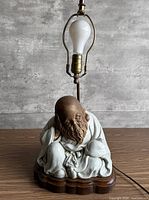 Front view showing full lamp and figure detail