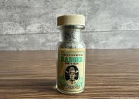 Front view showing label Genuine US Ranger Bucks on glass bottle