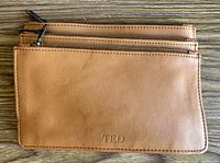 Front view showing TED logo and dual zippers