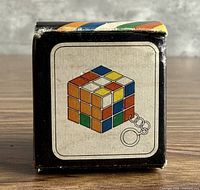 Front of box with Rubik's Cube graphic and chain icon