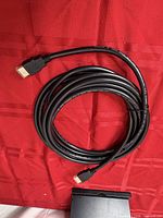 Full view of coiled 15-ft HDMI cable showing both Type A connectors