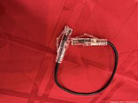 Entire cable showing both clear insulated clips on black wire