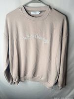 Front view of beige crewneck sweatshirt