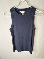 Front view of navy rib tank top on hanger showing overall condition and style