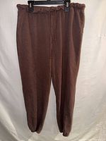 Front view of brown jogger sweatpants on hanger