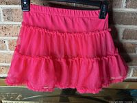 Full view of hot pink tiered tulle skirt front