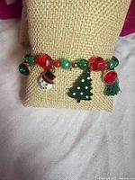 Front view of bracelet showing beads and charms