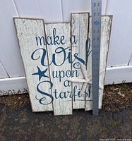 Full view of wall sign showing design, text, starfish accent