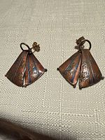 Front view of both copper-tone enamel fan earrings