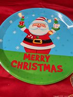 Front view of round tray showing full Santa graphic and text