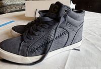 Side view of pair of gray high-top sneakers