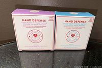 Front view of both Hand Defense sponge boxes showing scents and 40+ wash claim