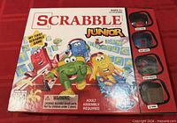 Front of Scrabble Junior box showing branding and age/player info