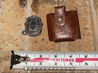 Pendant, leather pouch, Craftsman ruler showing scale