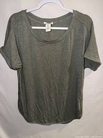 Front view of Matty M olive gray scoop neck T-shirt on hanger