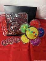 All three gel-filled fidget toys displayed together: flower, spiral, and S-shape