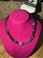 Napier choker displayed on stand with tag visible
