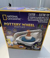 Retail box front showing National Geographic Pottery Wheel Craft Kit branding and contents illustration